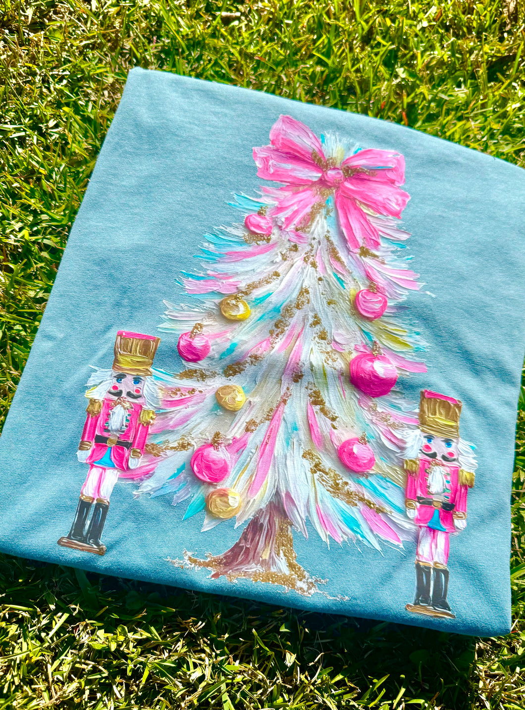 Pink blue painted tree nutcracker tee