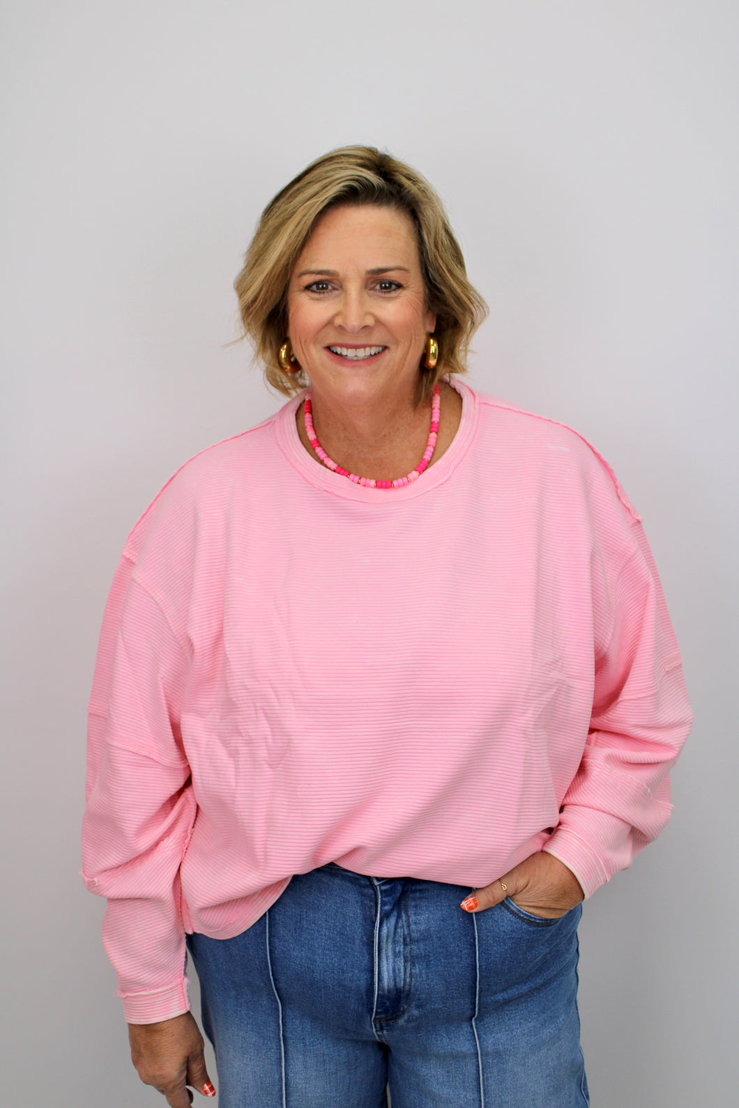 Pink ribbed round hem pullover