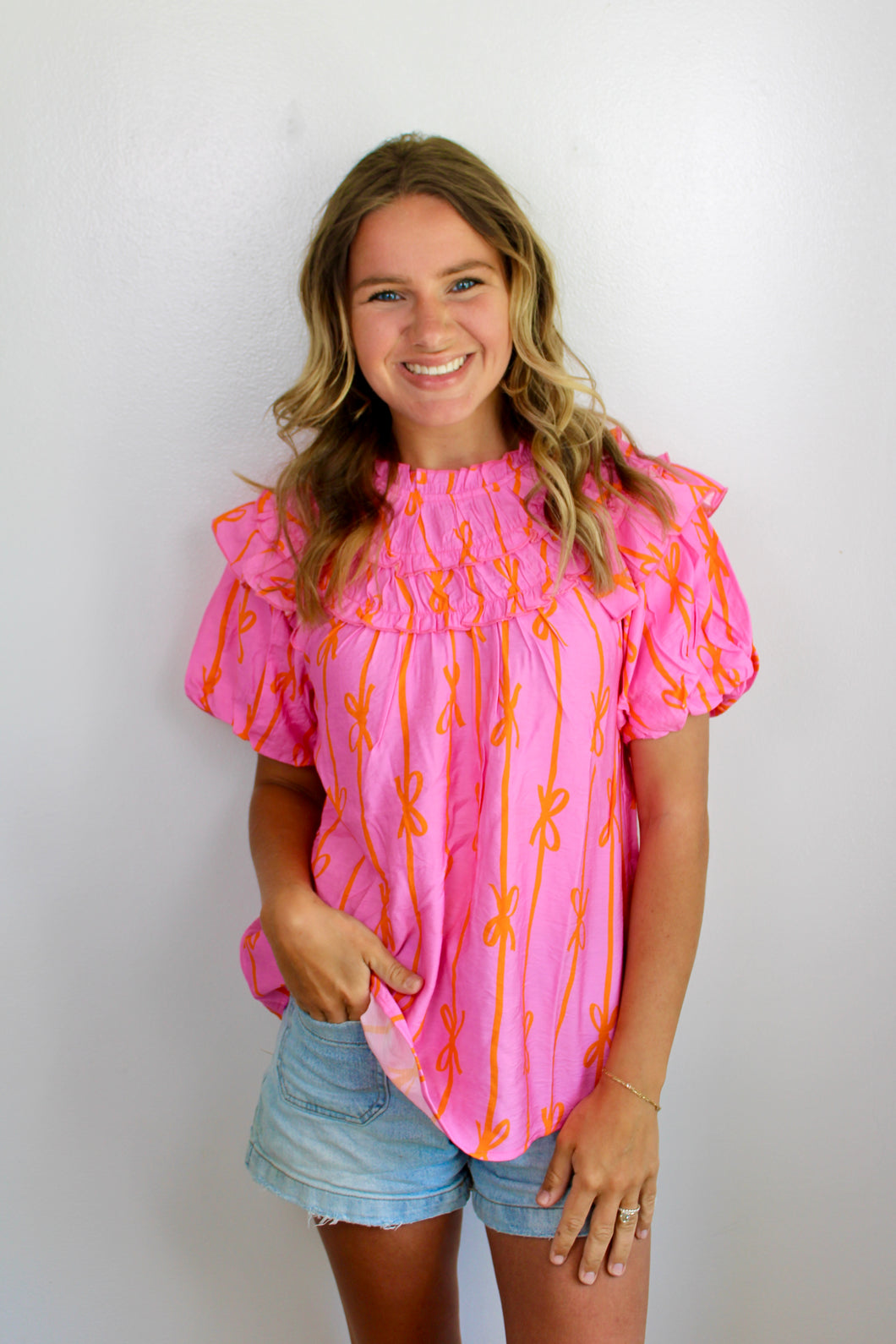 Orange pink bow top