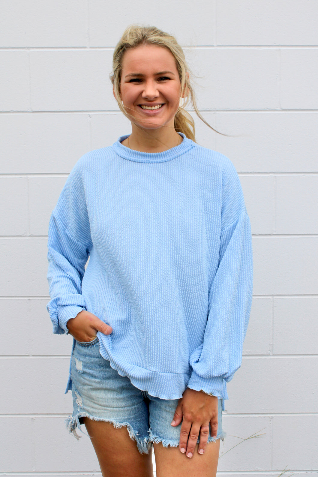 Baby blue ruffle edge top