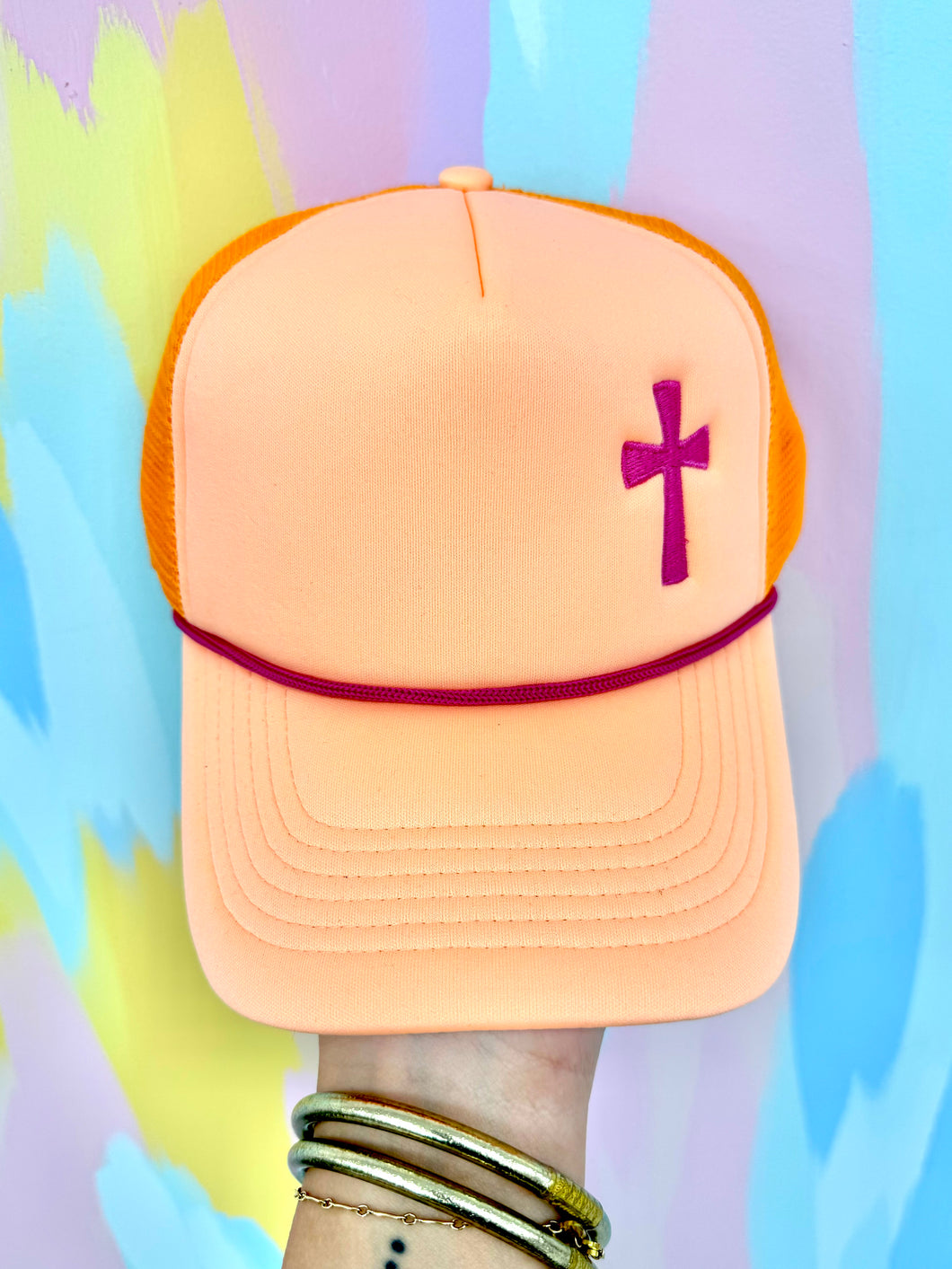 Orange pink cross trucker hat