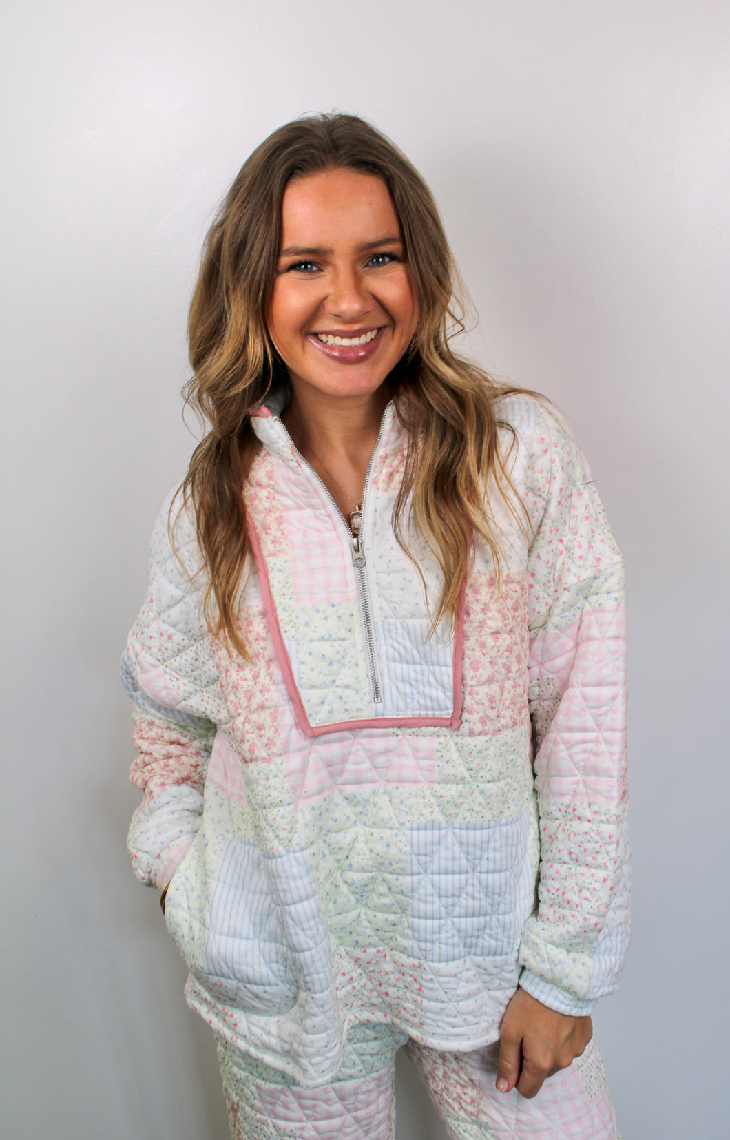 Floral textured zip pull-over