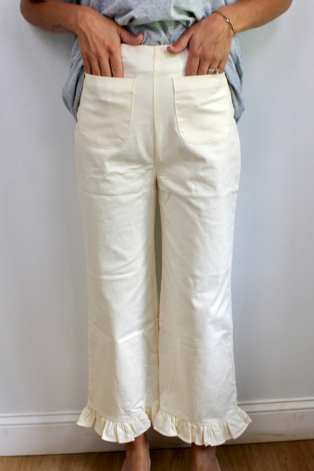 Cream ruffle pants