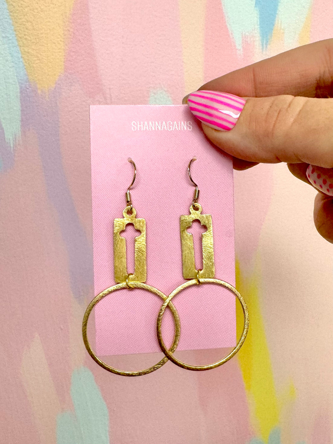 Gold round cross earrings