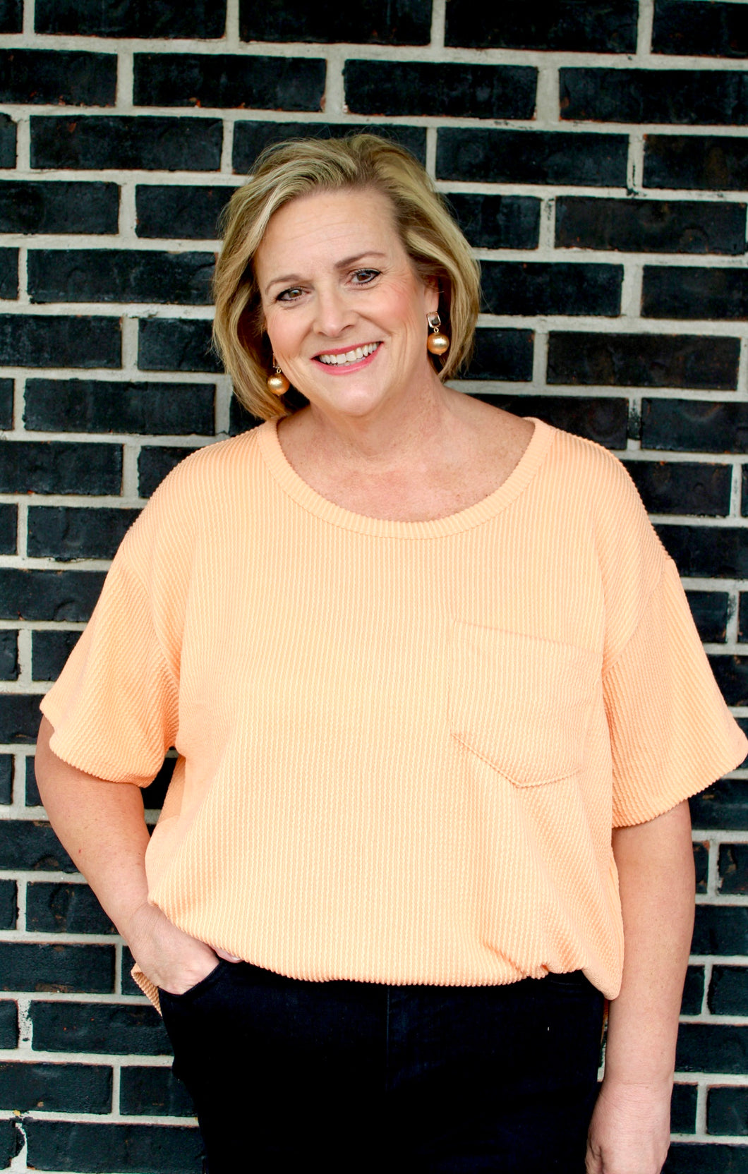 Orange curvy ribbed top