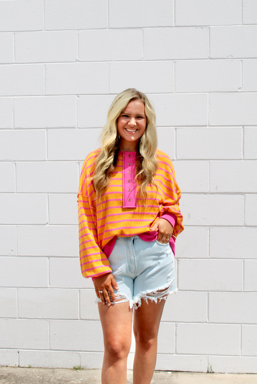 Pink orange stripe button top