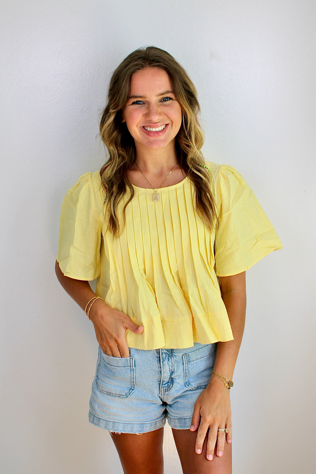 Yellow pleated top