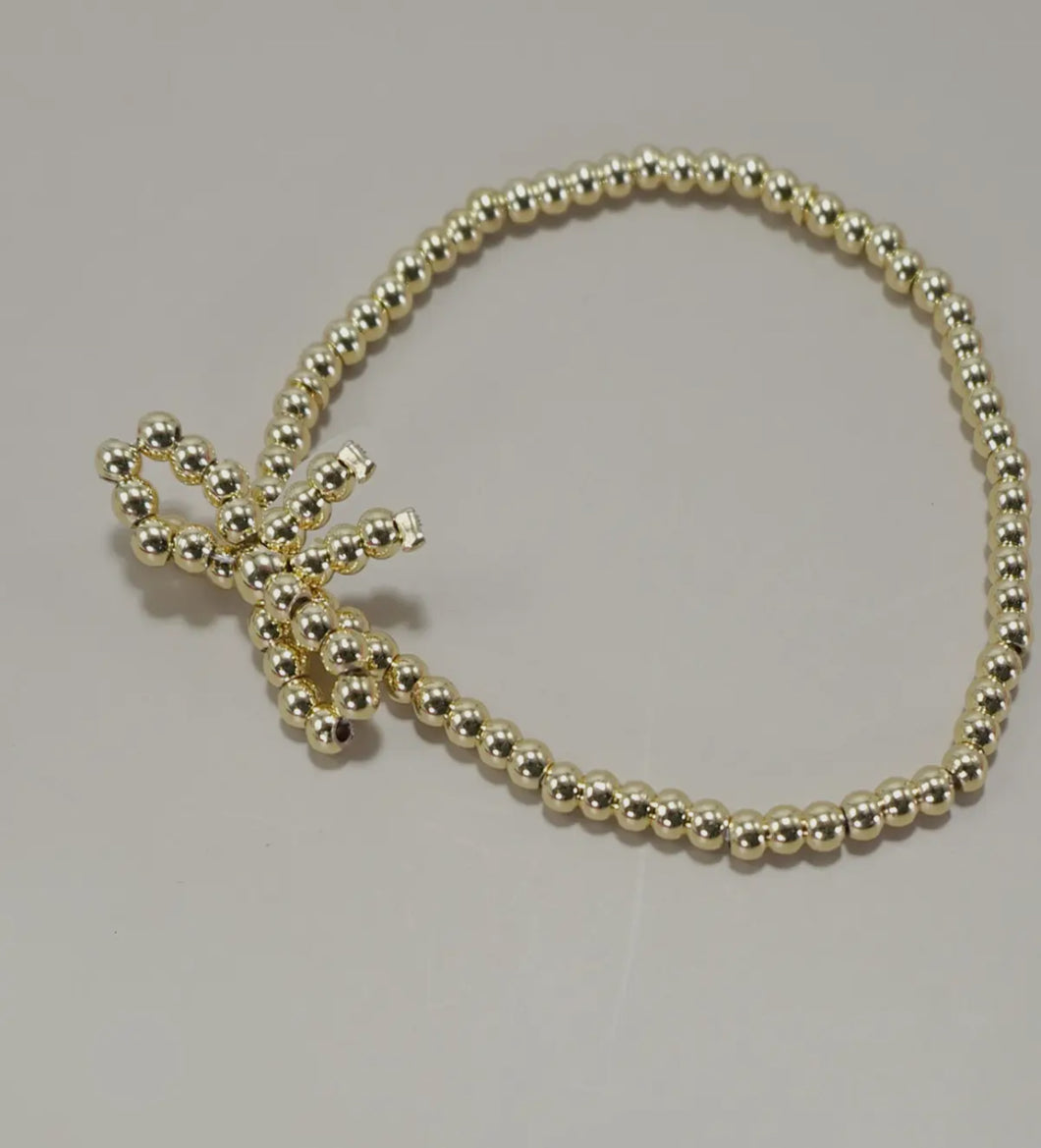Small gold bow bracelet