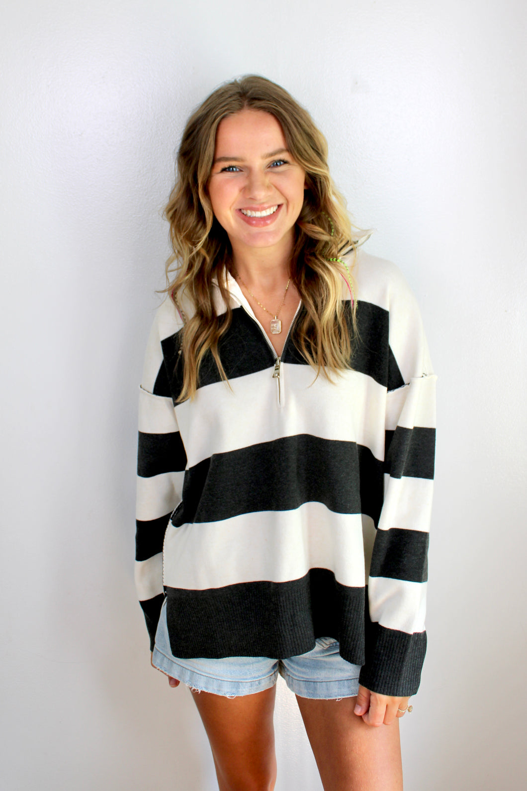 Black ivory zip pullover top