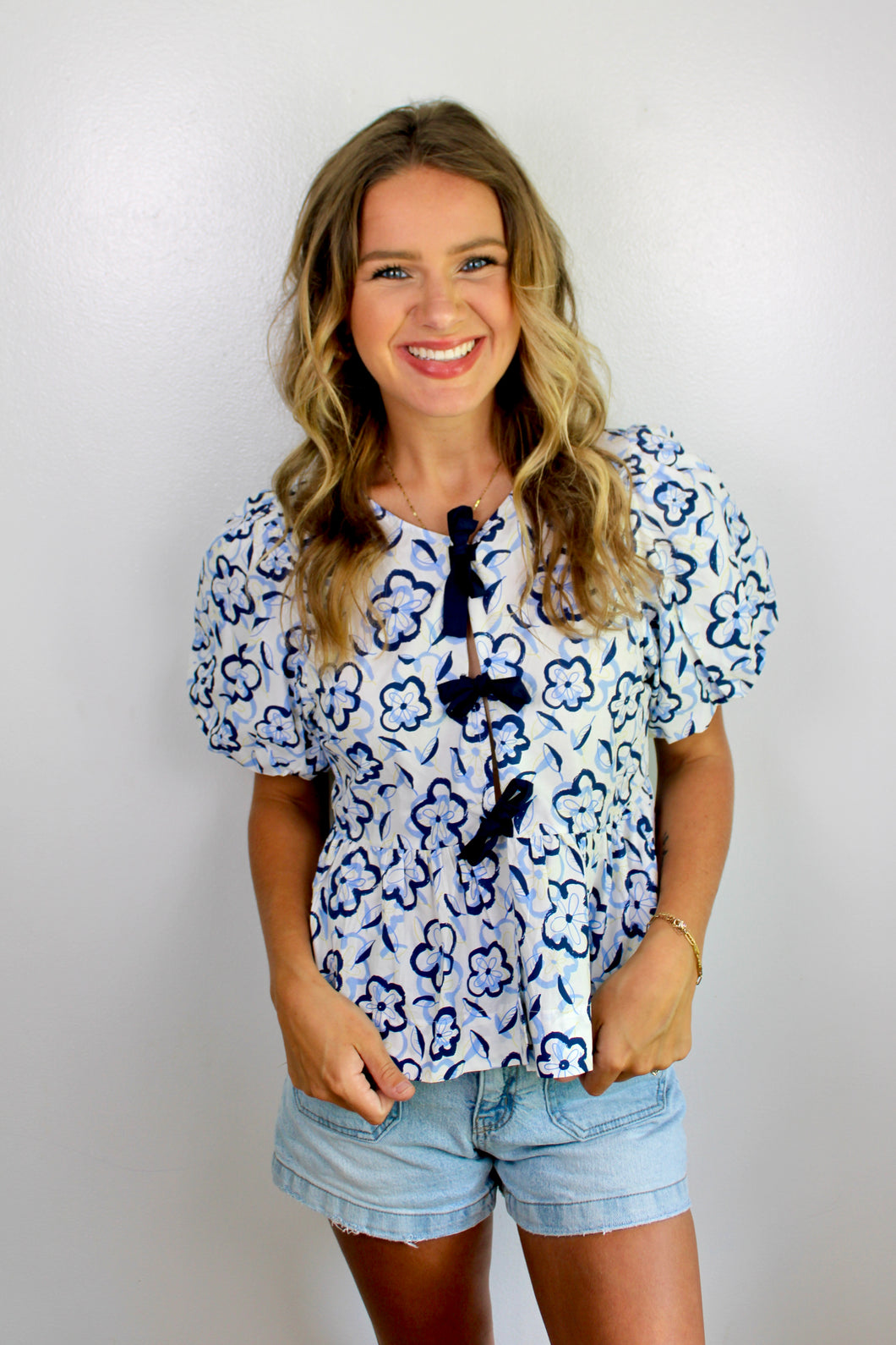 Navy floral bow top