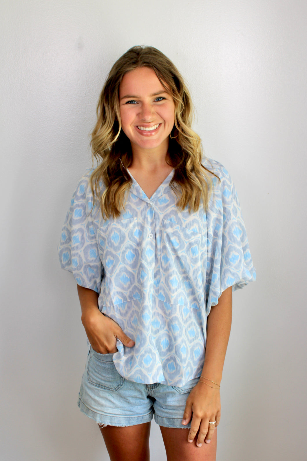 Geometric blue button top