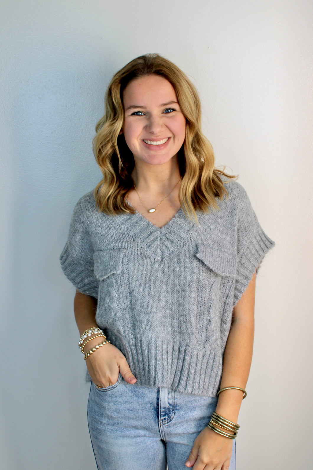 Grey sweater vest