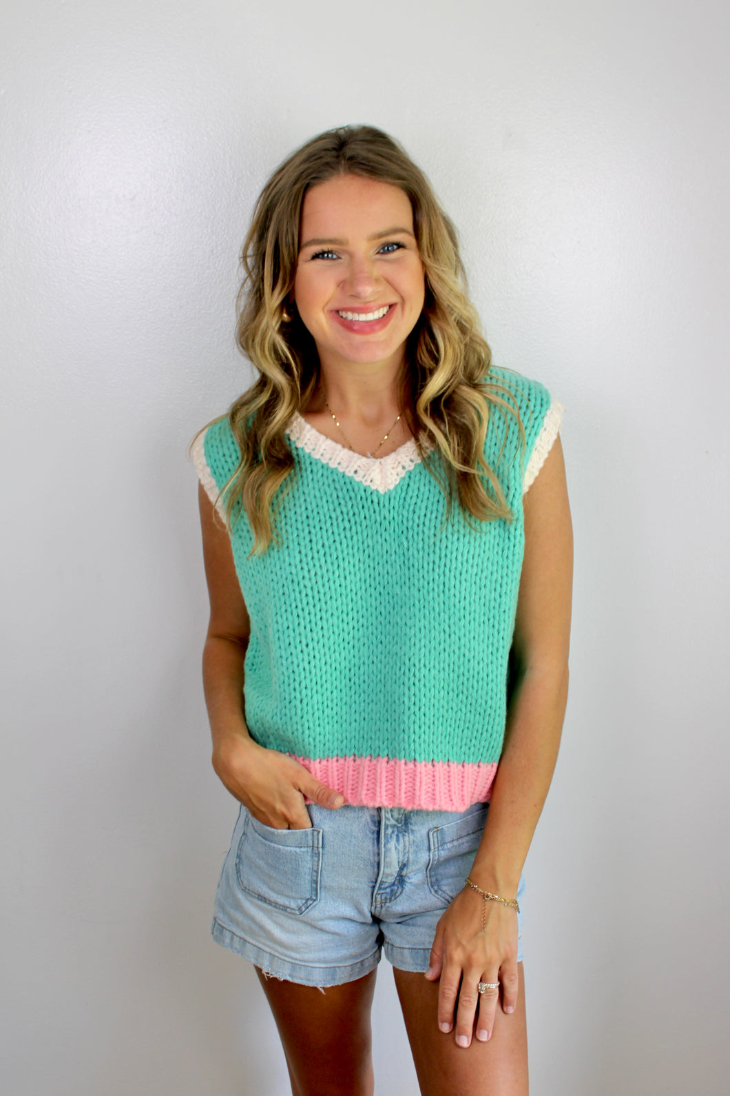 Green pink knit top