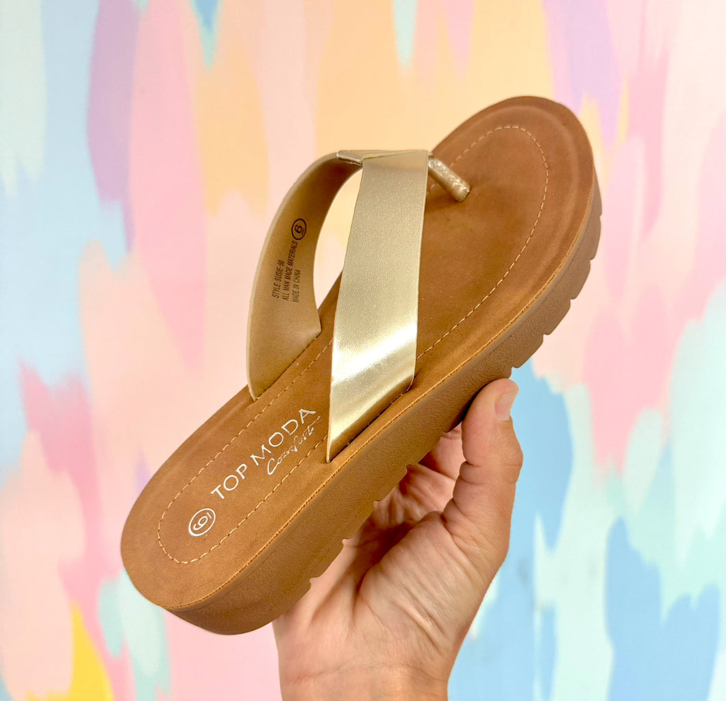 Gold flip flops